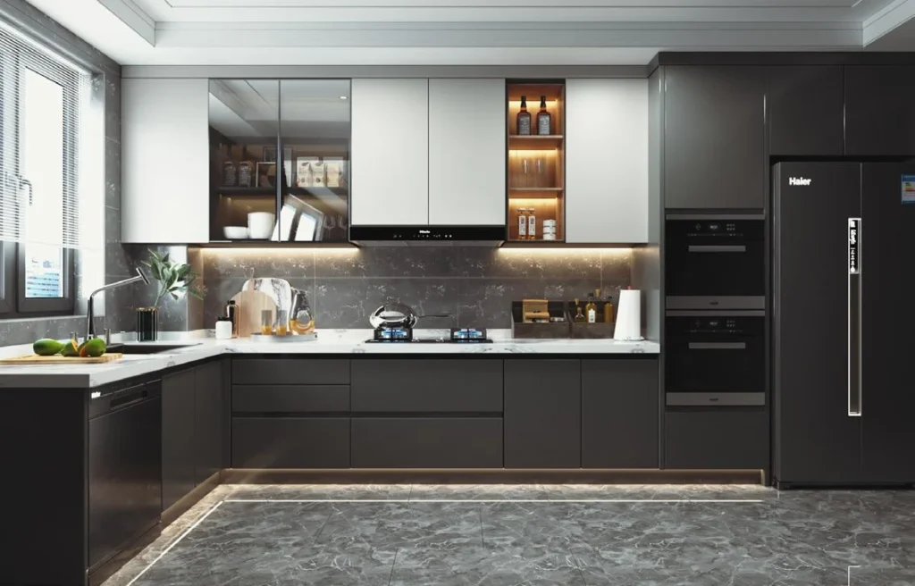 Contemporary L-shaped kitchen featuring two-tone grey and white sleek cabinetry with seamlessly built-in wall ovens.