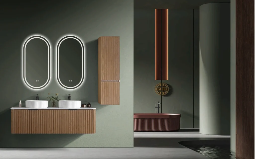 Minimalist fluted wood double bathroom vanity set with pure white ceramic vessel sinks, twin oval smart mirrors, and wall-mounted storage for boutique hotel bathrooms.