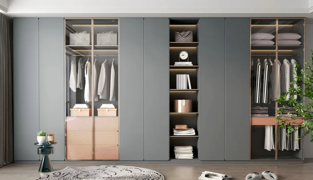 Modern minimalist custom wardrobe featuring matte grey panels, integrated LED display shelving, and safety glass doors for luxury residential projects by George Homes.