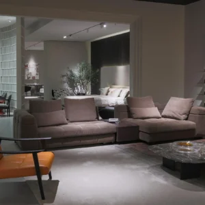 Taupe grid-tufted lounge sofa highlighting its low-profile silhouette.