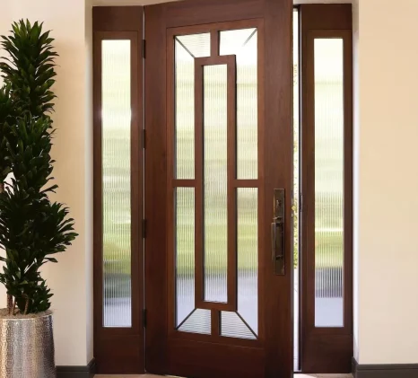 Elegant solid wood door with glass sidelights and geometric ribbed glass inserts, offering natural light and privacy for luxury homes.
