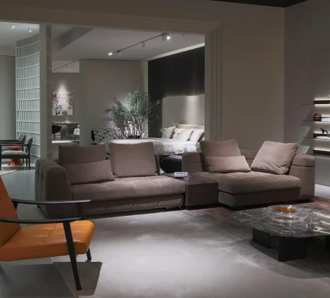 Taupe grid-tufted lounge sofa highlighting its low-profile silhouette.